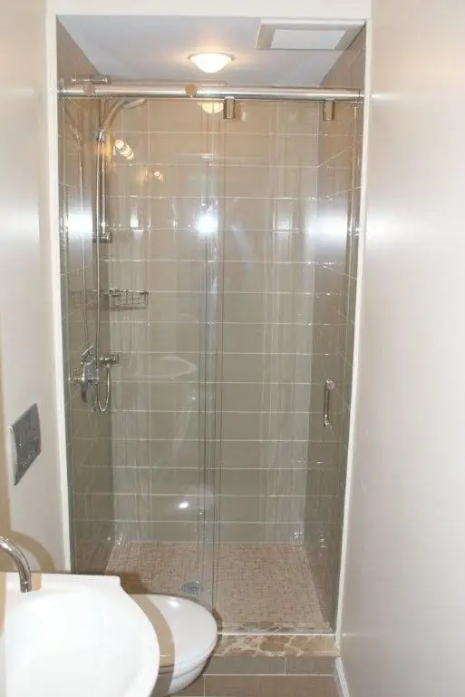 Hydroslide sliding shower door
