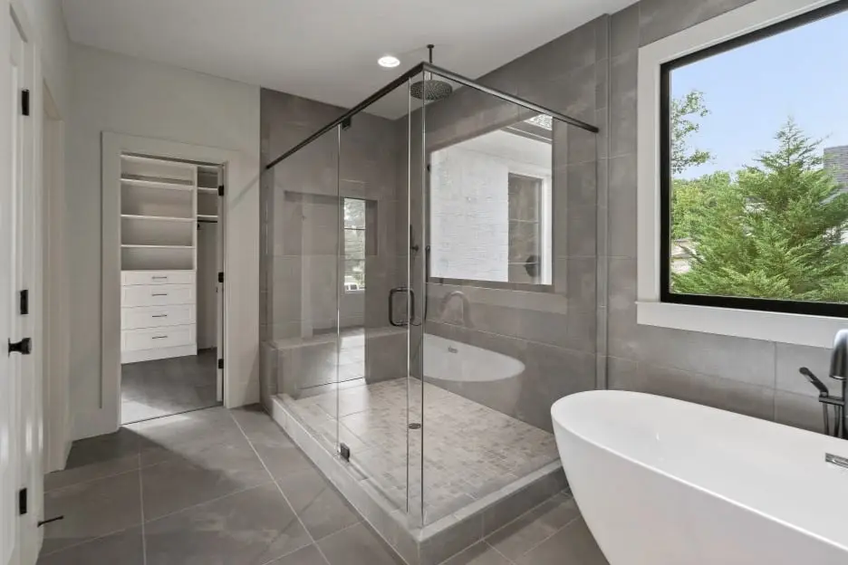 corner shower door using a top header for support oil rubbed